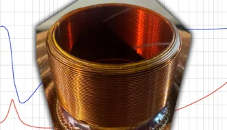 A sound graph as background, with a coil of wire on it